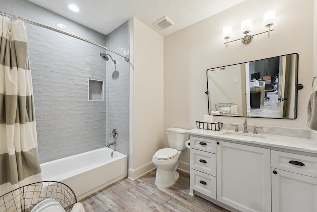 9343 Kai Dr, Beach City, TX 77523 - full bathroom with wood finished floors, toilet, vanity, shower / bath combo with shower curtain, and baseboards