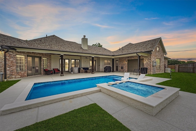 9343 Kai Dr, Beach City, TX 77523 - pool at dusk featuring ceiling fan, french doors, a patio, central air condition unit, and an outdoor living space