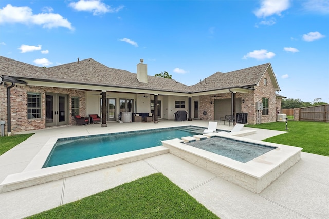 9343 Kai Dr, Beach City, TX 77523 - view of swimming pool featuring a ceiling fan, a patio area, french doors, a pool with connected hot tub, and cooling unit