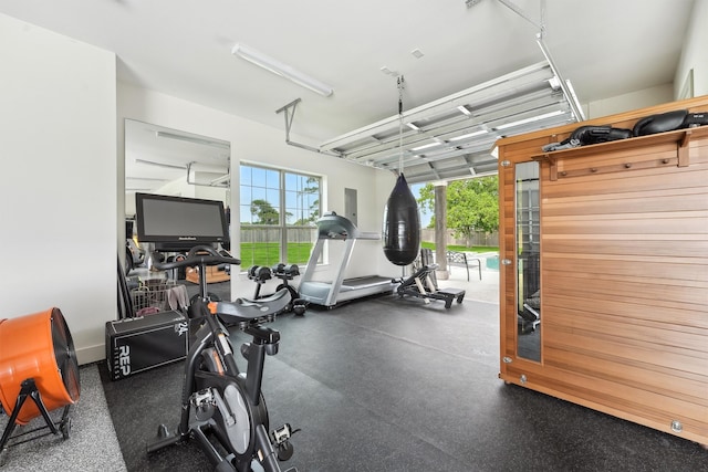 9343 Kai Dr, Beach City, TX 77523 - exercise area featuring a garage and electric panel
