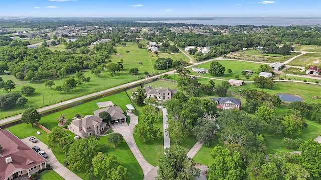 9343 Kai Dr, Beach City, TX 77523 - aerial overview of property's location featuring a nearby body of water, nearby suburban area, and a tree filled landscape