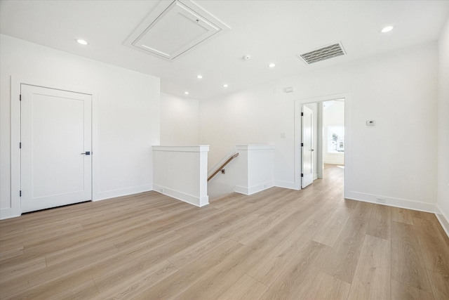 1201 E 27th St, Houston, TX 77009 - unfurnished room with light wood-style flooring, recessed lighting, baseboards, and attic access