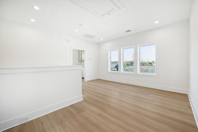 1201 E 27th St, Houston, TX 77009 - unfurnished room featuring light wood-style flooring, baseboards, and recessed lighting