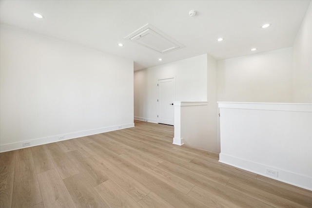 1201 E 27th St, Houston, TX 77009 - unfurnished room featuring attic access, light wood-style floors, recessed lighting, a smoke detector, and baseboards