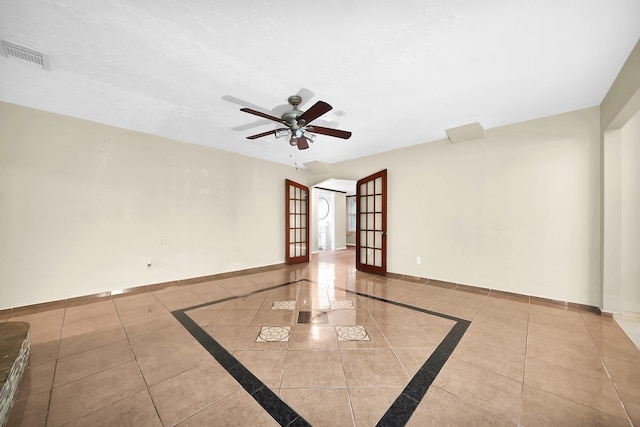 8030 Dodiewood Ln, Houston, TX 77086 - tiled spare room featuring a ceiling fan, inlaid floor details, and baseboards