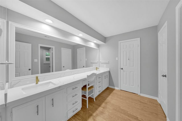 16111 Maplehurst Dr, Houston, TX 77379 - full bath featuring double vanity, wood finished floors, baseboards, and recessed lighting
