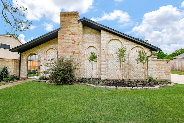 2735 Triway Ln, Houston, TX 77043 - view of property exterior featuring a chimney, a gate, brick siding, and stone siding