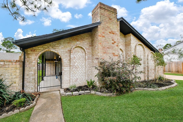 2735 Triway Ln, Houston, TX 77043 - doorway to property with brick siding, a chimney, and a gate
