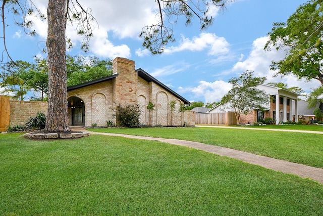2735 Triway Ln, Houston, TX 77043 - view of front facade with a chimney and brick siding