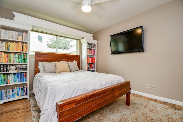 2735 Triway Ln, Houston, TX 77043 - bedroom featuring wood finished floors, baseboards, and ceiling fan