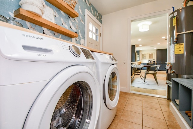 2735 Triway Ln, Houston, TX 77043 - laundry area with independent washer and dryer, water heater, light tile patterned flooring, recessed lighting, and baseboards