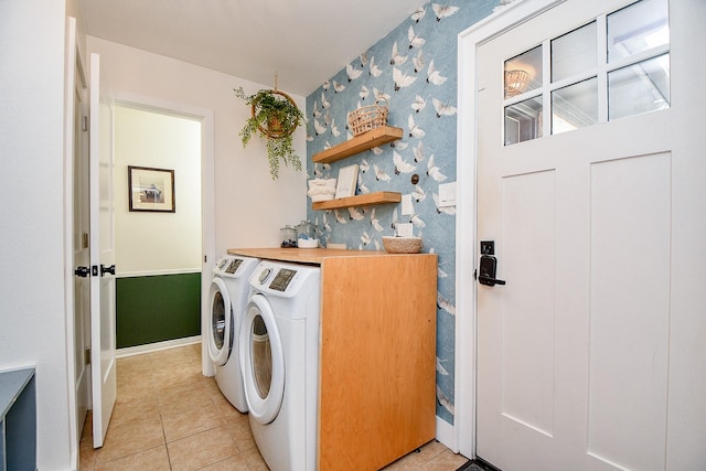 2735 Triway Ln, Houston, TX 77043 - laundry area with separate washer and dryer, wallpapered walls, light tile patterned floors, and baseboards