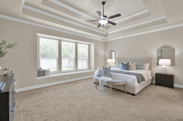 13518 Ambler Springs Dr, Tomball, TX 77377 - bedroom with a raised ceiling, light carpet, crown molding, baseboards, and ceiling fan
