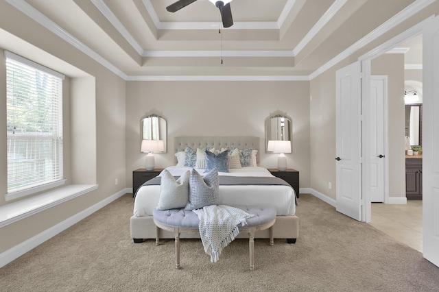 13518 Ambler Springs Dr, Tomball, TX 77377 - bedroom featuring a tray ceiling, light carpet, baseboards, crown molding, and a ceiling fan