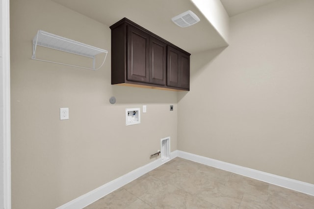 13518 Ambler Springs Dr, Tomball, TX 77377 - washroom featuring washer hookup, hookup for an electric dryer, baseboards, hookup for a gas dryer, and cabinet space