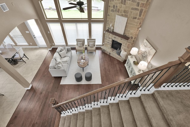 13518 Ambler Springs Dr, Tomball, TX 77377 - living room with a ceiling fan, plenty of natural light, a towering ceiling, and arched walkways