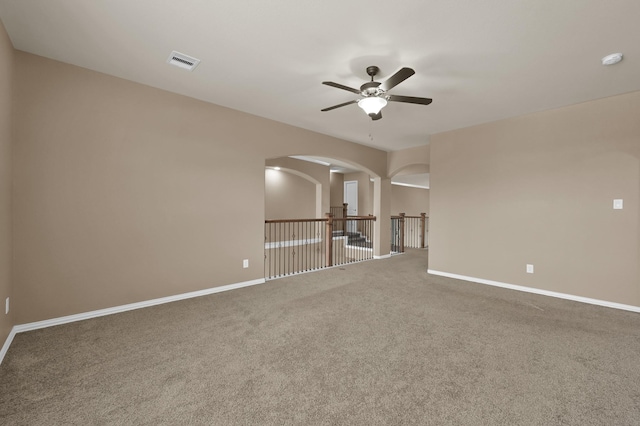 13518 Ambler Springs Dr, Tomball, TX 77377 - carpeted spare room featuring ceiling fan, a smoke detector, arched walkways, and baseboards