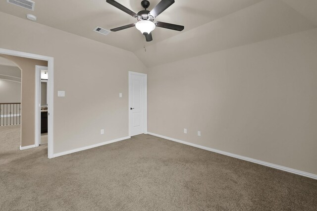 13518 Ambler Springs Dr, Tomball, TX 77377 - unfurnished bedroom featuring carpet flooring, arched walkways, baseboards, lofted ceiling, and ceiling fan