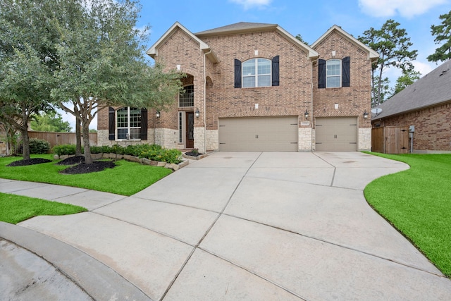 13518 Ambler Springs Dr, Tomball, TX 77377 - traditional-style home with brick siding, an attached garage, concrete driveway, and stone siding