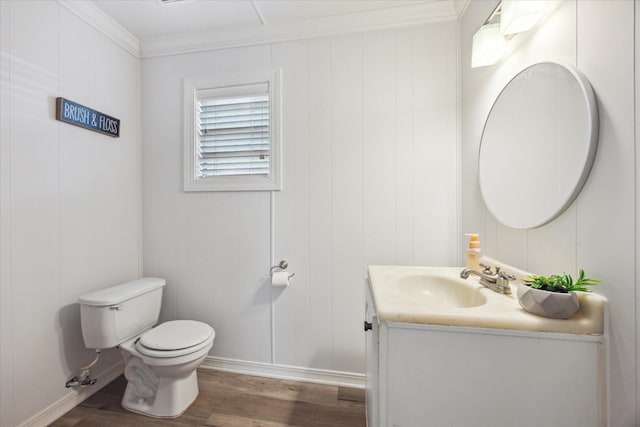 10228 Brinwood Dr, Houston, TX 77043 - half bathroom with wood finished floors, vanity, toilet, crown molding, and baseboards