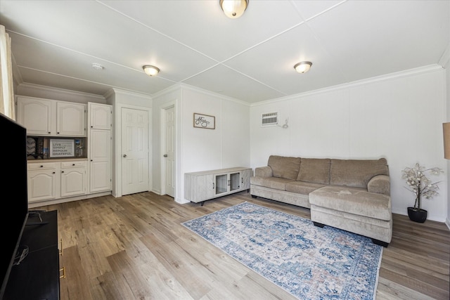 10228 Brinwood Dr, Houston, TX 77043 - living room with light wood finished floors, ornamental molding, and baseboards