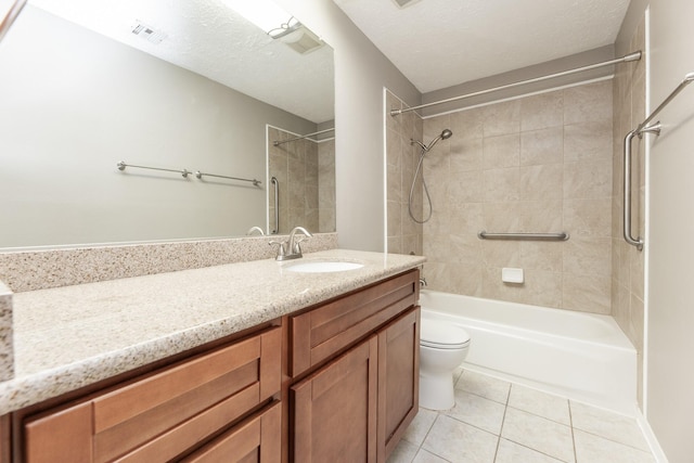 2543 Sage Brush Ln, Sugar Land, TX 77479 - full bath with washtub / shower combination, vanity, tile patterned flooring, toilet, and a textured ceiling