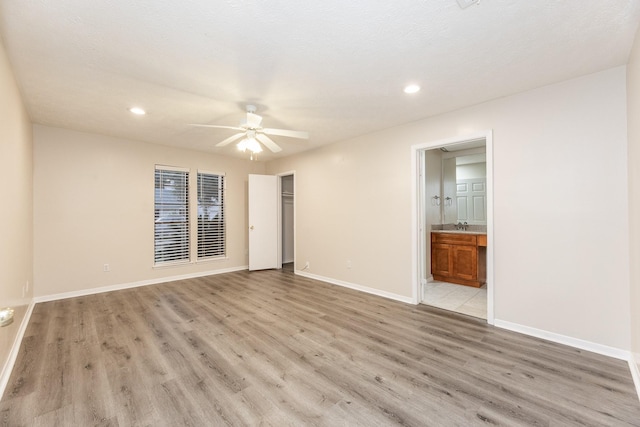 2543 Sage Brush Ln, Sugar Land, TX 77479 - spare room with ceiling fan, light wood-style floors, baseboards, and recessed lighting