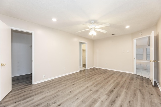 2543 Sage Brush Ln, Sugar Land, TX 77479 - unfurnished room with light wood-style flooring, recessed lighting, ceiling fan, and baseboards