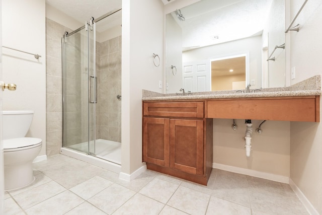 2543 Sage Brush Ln, Sugar Land, TX 77479 - bathroom featuring toilet, a stall shower, tile patterned floors, baseboards, and vanity