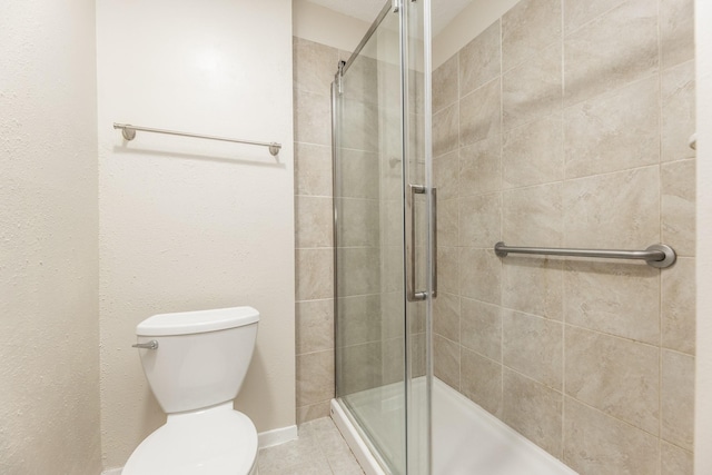2543 Sage Brush Ln, Sugar Land, TX 77479 - bathroom with a stall shower, toilet, and tile patterned flooring