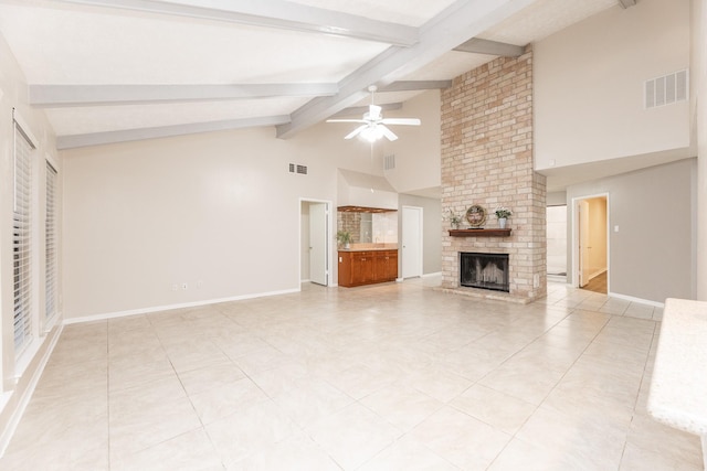 2543 Sage Brush Ln, Sugar Land, TX 77479 - unfurnished living room featuring beam ceiling, a brick fireplace, ceiling fan, high vaulted ceiling, and baseboards