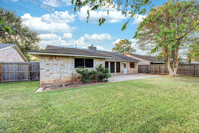 2543 Sage Brush Ln, Sugar Land, TX 77479 - back of house with a patio, a chimney, and a shingled roof
