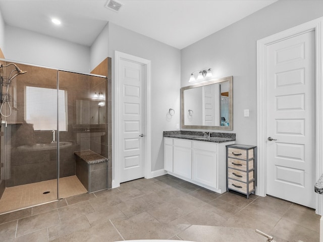 2314 Navo Ln, League City, TX 77573 - bathroom with a stall shower, vanity, and baseboards