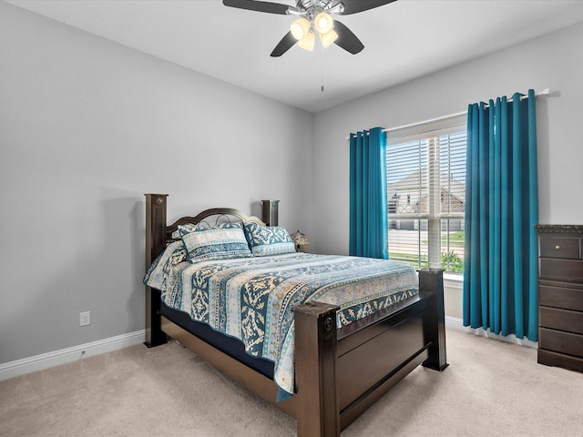 2314 Navo Ln, League City, TX 77573 - bedroom with carpet floors, baseboards, and ceiling fan