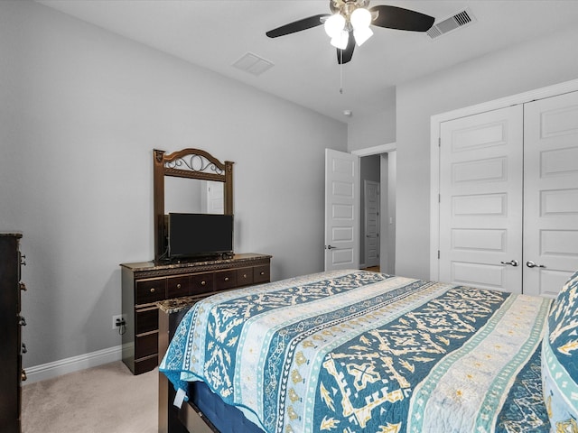 2314 Navo Ln, League City, TX 77573 - bedroom with light colored carpet, a closet, ceiling fan, and baseboards