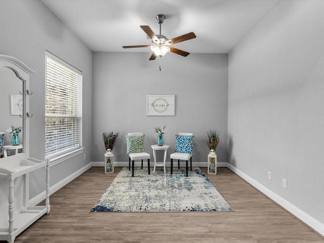 2314 Navo Ln, League City, TX 77573 - living area with ceiling fan, wood finished floors, and baseboards