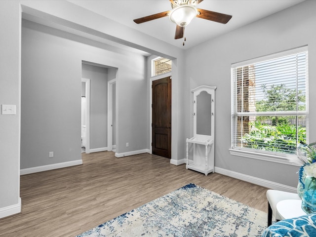 2314 Navo Ln, League City, TX 77573 - living area with plenty of natural light, wood finished floors, baseboards, and a ceiling fan