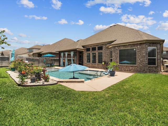 2314 Navo Ln, League City, TX 77573 - rear view of house with a patio, brick siding, and roof with shingles