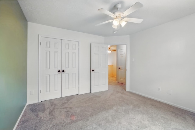 3218 Barkers Forest Ln, Houston, TX 77084 - unfurnished bedroom with carpet flooring, a closet, baseboards, and a ceiling fan