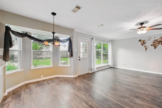 3218 Barkers Forest Ln, Houston, TX 77084 - unfurnished dining area with a chandelier, wood finished floors, a ceiling fan, baseboards, and crown molding