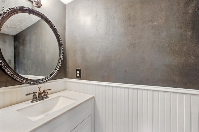 3218 Barkers Forest Ln, Houston, TX 77084 - bathroom with wainscoting and vanity