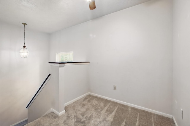 3218 Barkers Forest Ln, Houston, TX 77084 - empty room featuring light colored carpet, baseboards, and a ceiling fan