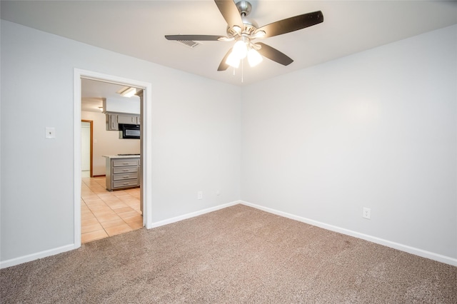 15319 Paseo Del Rey Dr, Houston, TX 77083 - spare room with light colored carpet, ceiling fan, and baseboards
