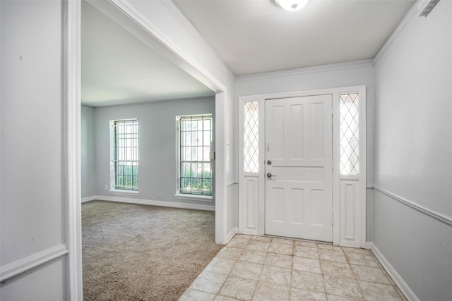 15319 Paseo Del Rey Dr, Houston, TX 77083 - entrance foyer with baseboards, ornamental molding, and light colored carpet