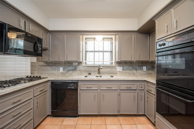 15319 Paseo Del Rey Dr, Houston, TX 77083 - kitchen with black appliances, a sink, gray cabinets, and decorative backsplash