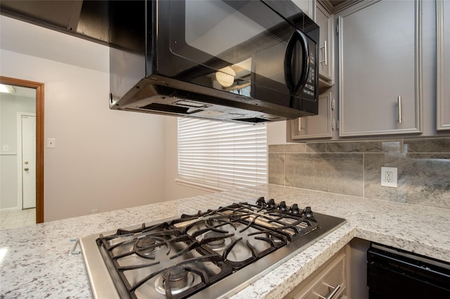 15319 Paseo Del Rey Dr, Houston, TX 77083 - kitchen featuring black appliances, gray cabinets, backsplash, and light stone countertops