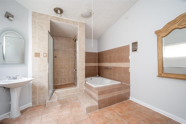 15319 Paseo Del Rey Dr, Houston, TX 77083 - bathroom featuring a garden tub, tile patterned floors, a shower stall, baseboards, and a sink