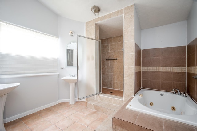 15319 Paseo Del Rey Dr, Houston, TX 77083 - bathroom featuring a jetted tub, tiled shower, a sink, and tile patterned floors