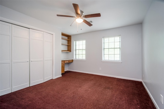 15319 Paseo Del Rey Dr, Houston, TX 77083 - unfurnished bedroom with dark colored carpet, a closet, and baseboards