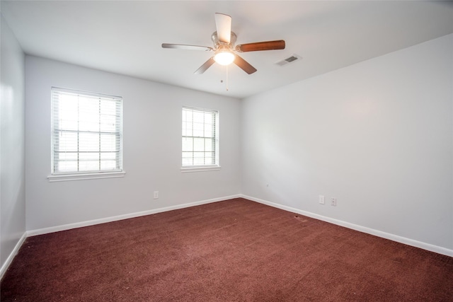 15319 Paseo Del Rey Dr, Houston, TX 77083 - spare room featuring dark colored carpet, baseboards, and a ceiling fan